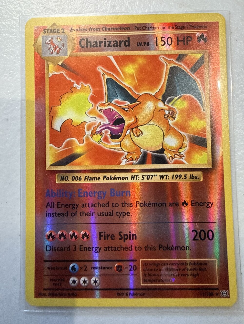 Pokemon Charizard Holographic Orange and Yellow Card